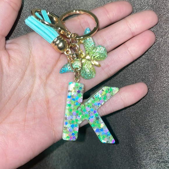 Accessories - Letter K in green with encapsulated butterflies. Keychain or bag charm